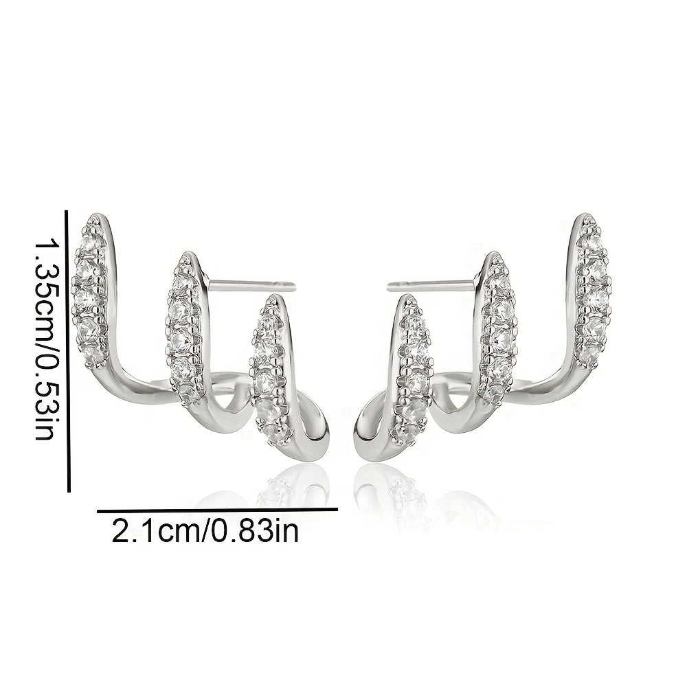 Pendientes con circonita en engaste de tres garras