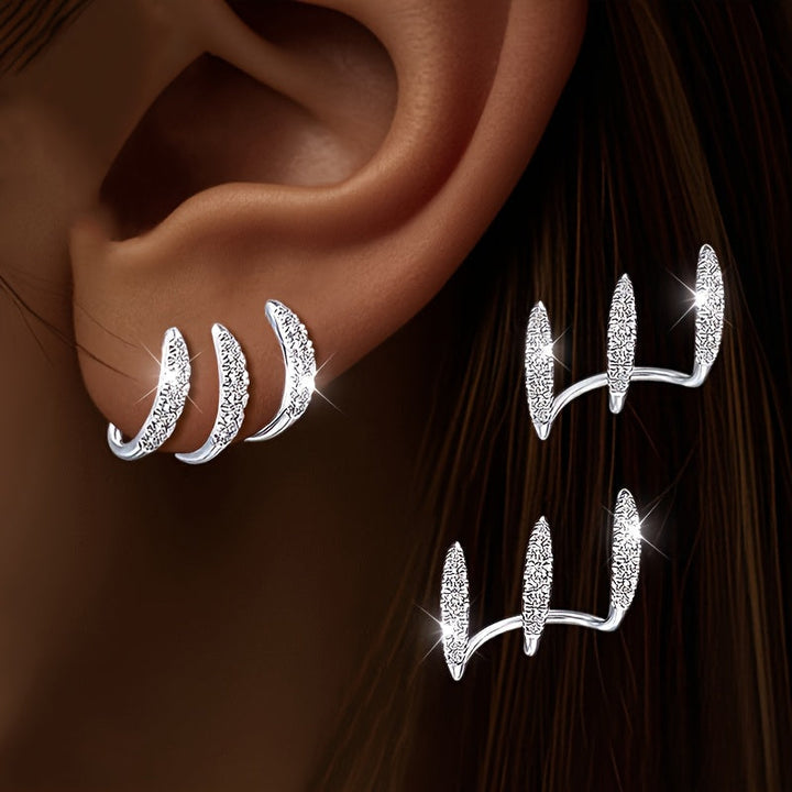 Pendientes con circonita en engaste de tres garras
